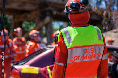 Melbourne, Victoria/Australia- November 11 2018: Rescuers conduct an dissection of a car and remove the victim. Indicative teachings. A SES commander standing from the back.