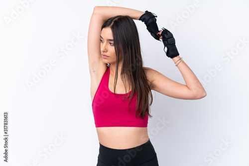 Fototapeta Naklejka Na Ścianę i Meble -  Young sport brunette woman over isolated white background stretching