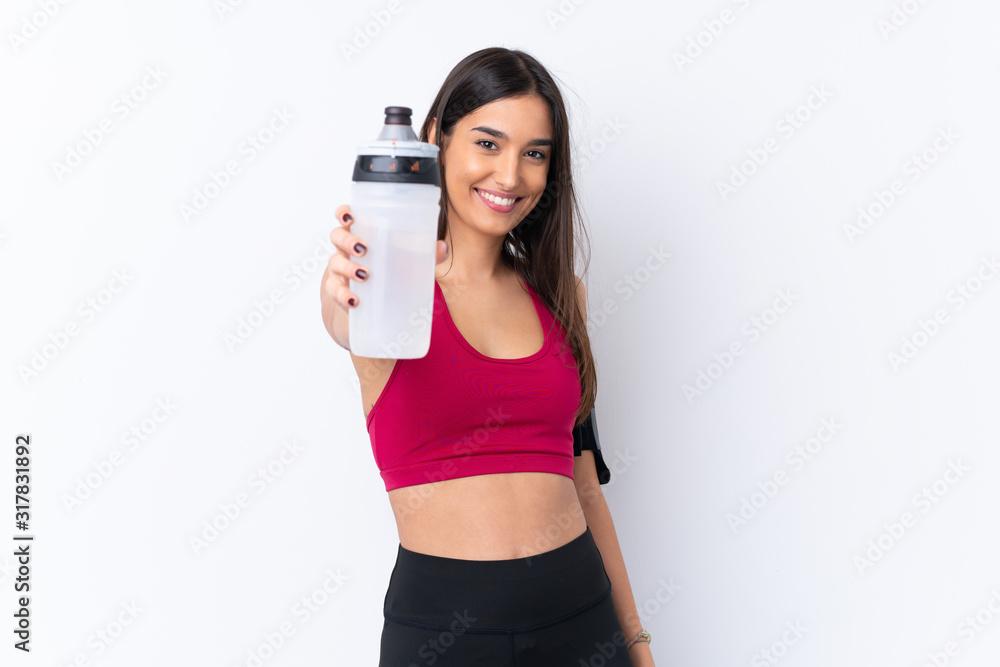 Young sport brunette woman over isolated white background with sports water bottle Young sport brunette woman over isolated white background with sports water bottle