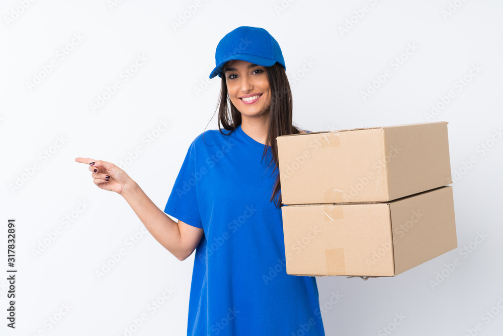 Young delivery woman over isolated white background pointing finger to the side Young delivery woman over isolated white background pointing finger to the side