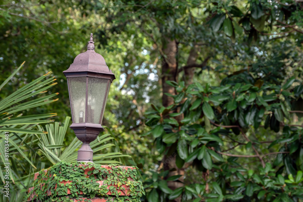 Decorative and useful outdoor lamp provides lighting and personality to the outdoor space. Bokeh