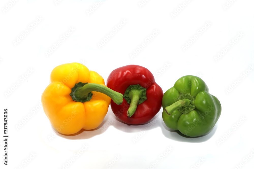 Sweet peppers, colorful vegetables placed on a white background