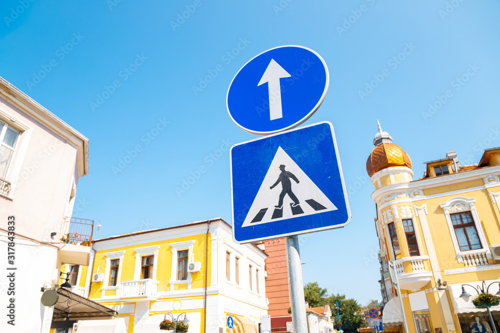 Traffic sign pedestrian crossing in European old town