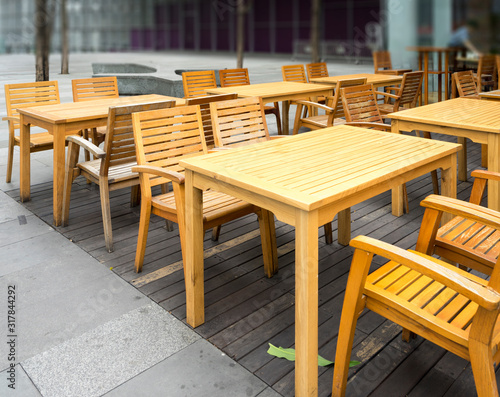 Fototapeta Naklejka Na Ścianę i Meble -  Wooden table in the outdoor coffee room