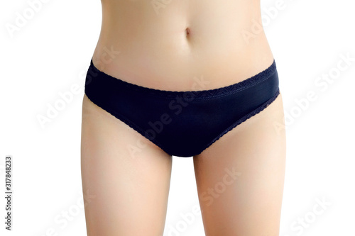 Skin and abdomen of a woman wearing black underwear on a white background. Health and beauty concepts