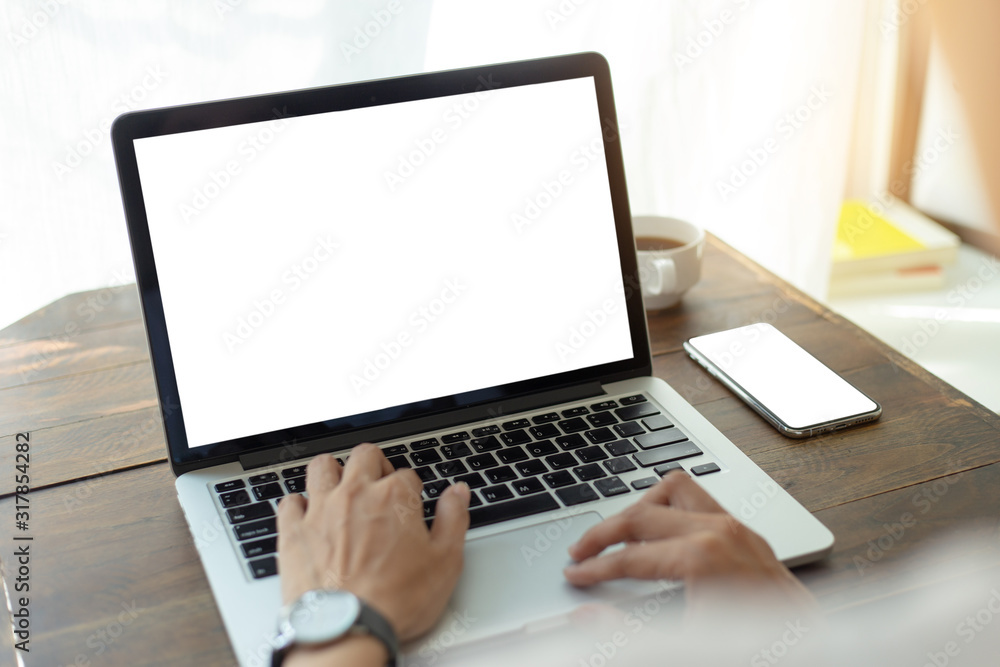 mockup image blank screen computer,cell phone with white background for advertising text,hand man using laptop texting mobile contact business search information on desk in office.marketing,design mockup image blank screen computer,cell phone with white background for advertising text,hand man using laptop texting mobile contact business search information on desk in office.marketing,design