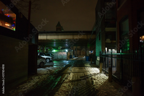 Dark and eerie urban city alley at night 