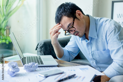 serious people frustrated exhausted work stress concept.businessman holding hands on face feeling tired suffering working on paperwork job in work place.concept global economic problems