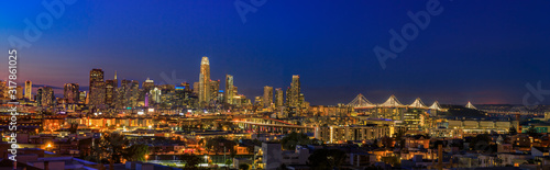 San Francisco skyline night panorama with city lights, the Bay Bridge and trail lights © SvetlanaSF