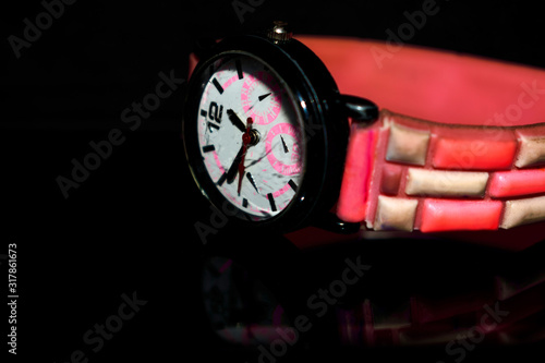 old wrist watch with pink strap