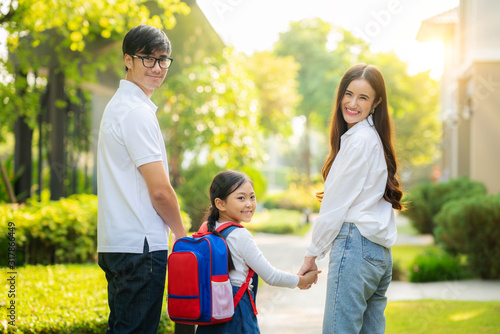 Asian family go to school together photo