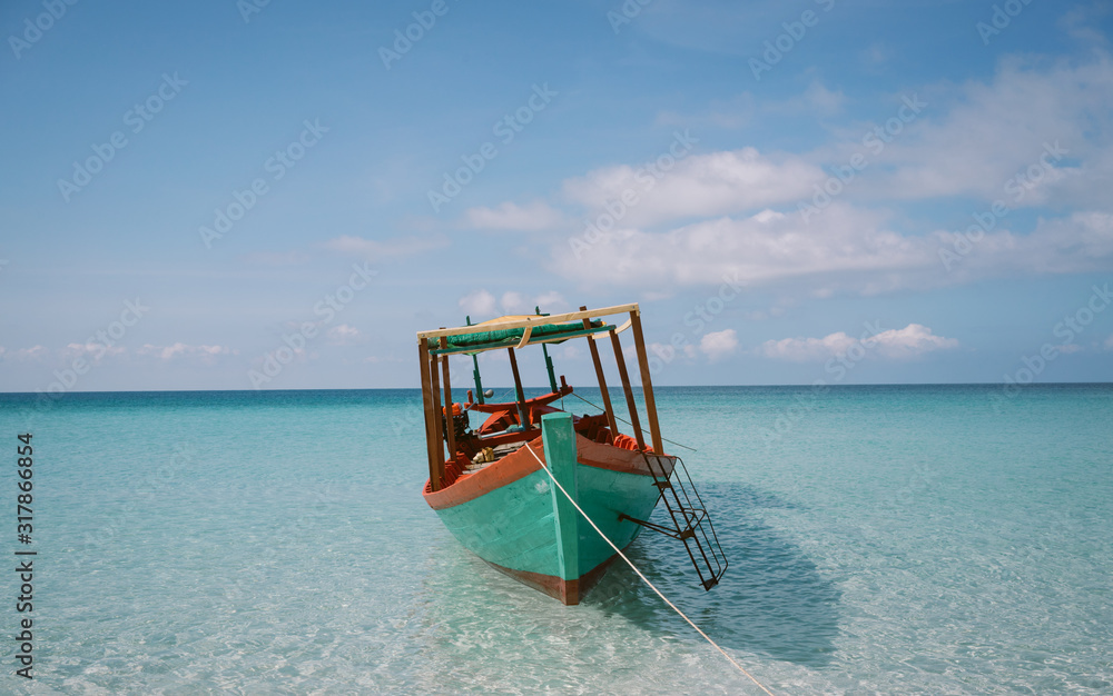 Long Tail Fishing Boat on Tropical Beach Long Tail Fishing Boat on Tropical Beach