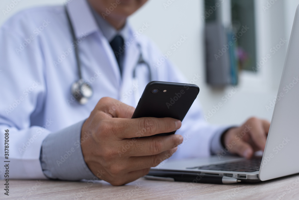 Doctor using smartphone Doctor using smartphone