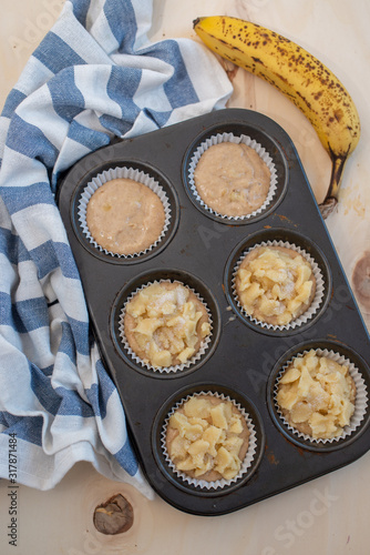 Homemade banana muffins on the wooden table
