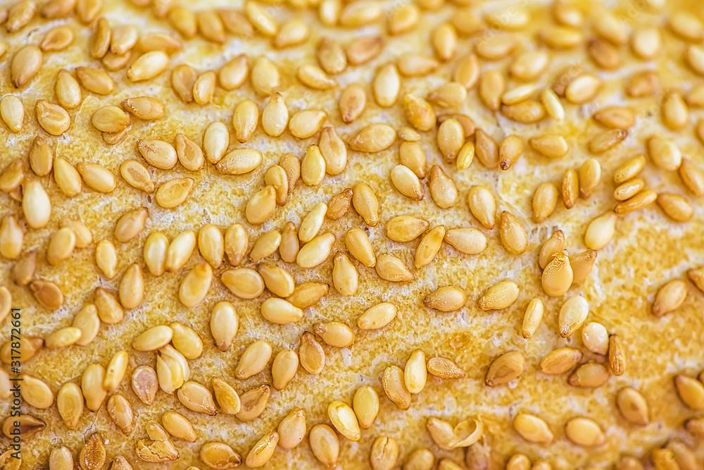 close macro sesame on the loaf of bread close macro sesame on the loaf of bread
