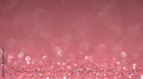Pink brilliant beautiful holiday texture in motion. Magic bokeh background