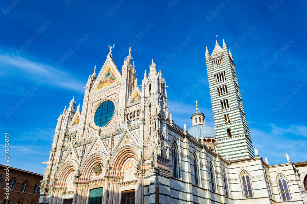 Siena Cathedral at a bright sunny day, in Siena, Italy.