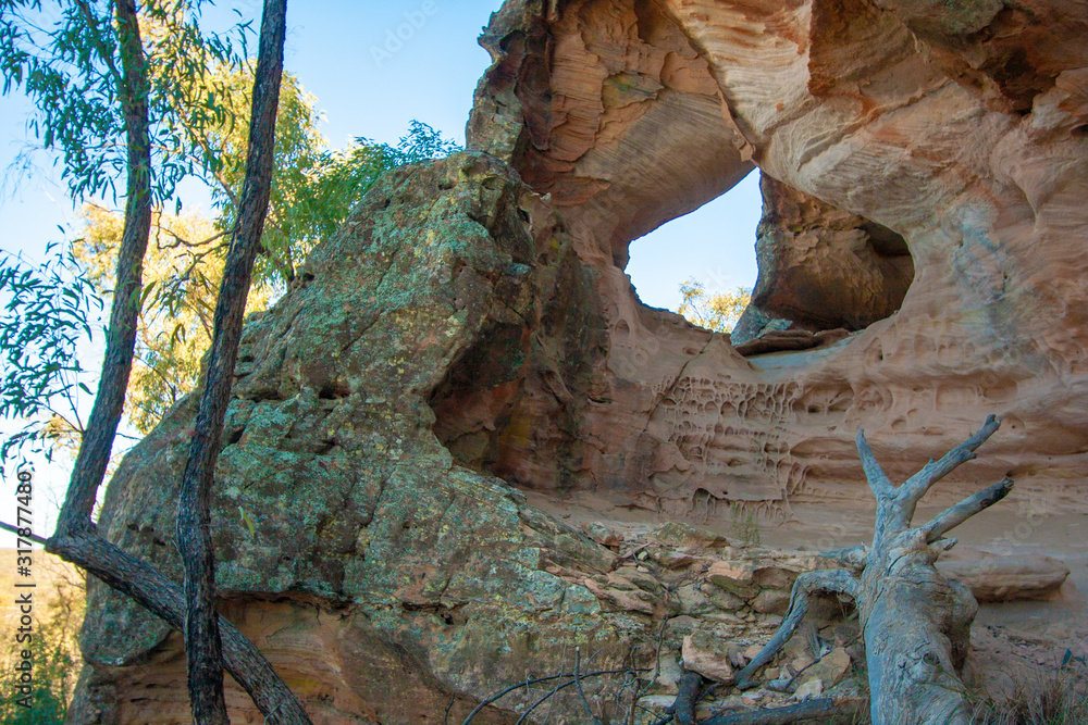 A hole in sandstone wall, view from outside. Sandstone Caves, Pilliga National Park, NSW, Australia.