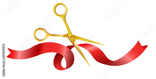 Gold shiny scissors cutting red silk ribbon for opening ceremony