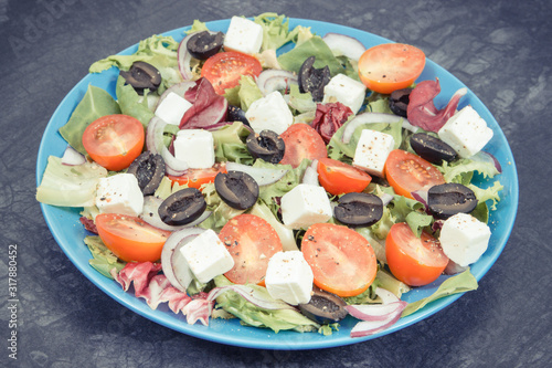 Greek salad with feta cheese and vegetables. Healthy lifestyles, food and nutrition concept