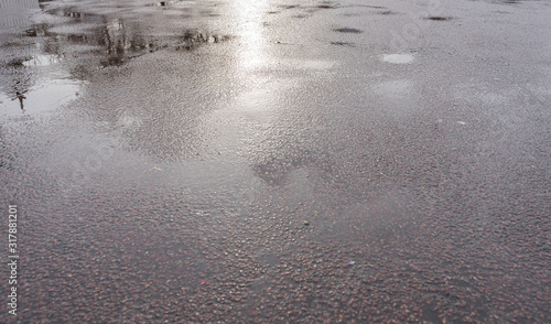 wet asphalt. gray coarse fabric