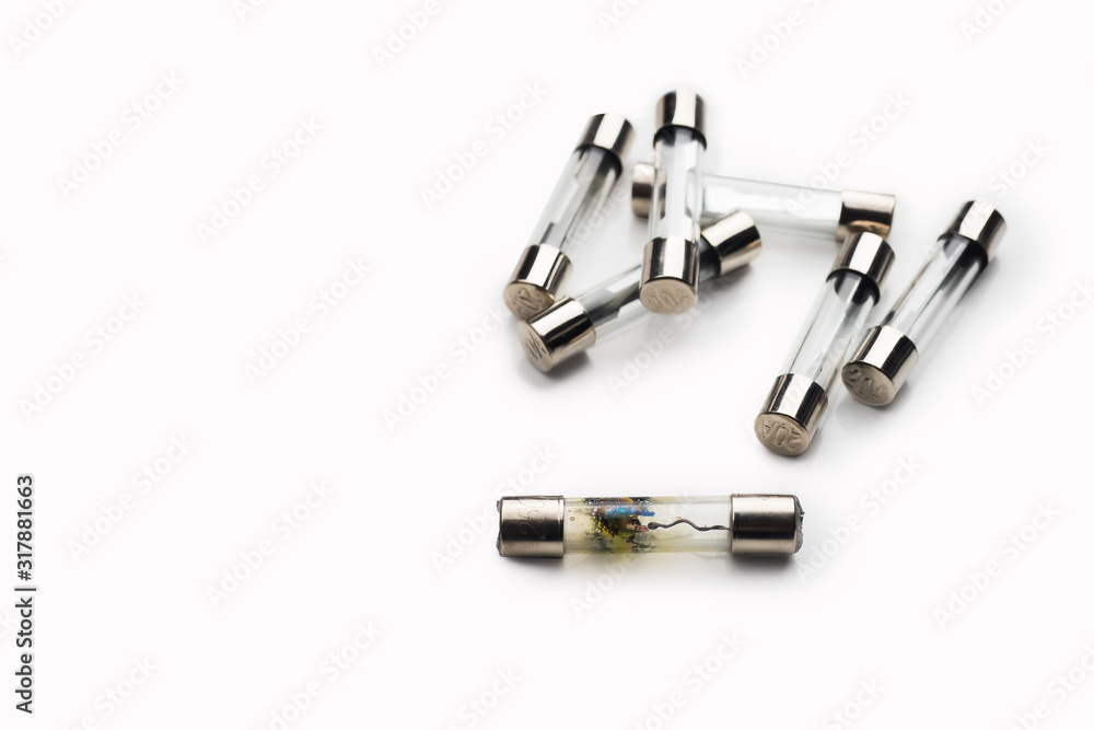 burned-out fuses (Short Circuit) and new fuses for Car ,motorcycle on white background burned-out fuses (Short Circuit) and new fuses for Car ,motorcycle on white background