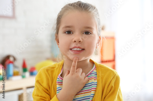 Photos Cute little girl at speech therapist office