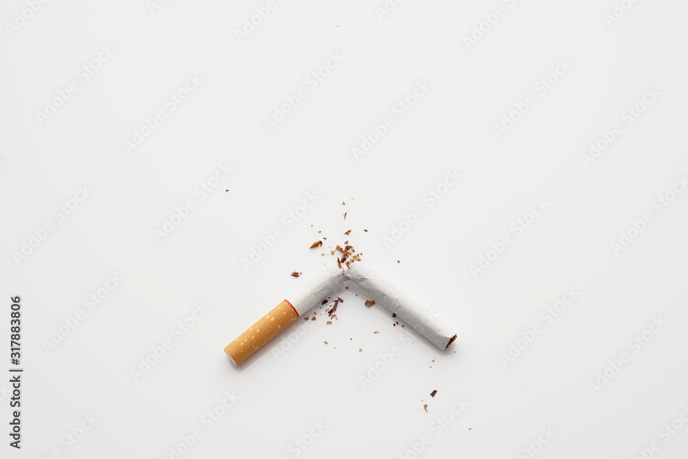 Broken cigarette on white background , World No Tobacco Day Tobacco and lung health concept .