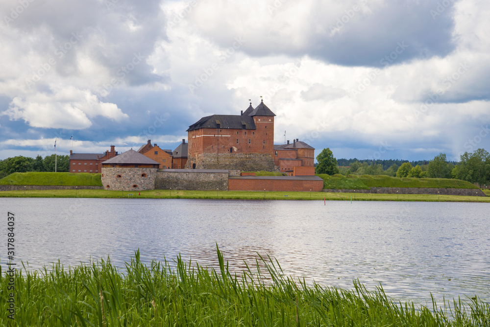 View of the ancient Hameenlinna fortress on a cloudy June day. Finland