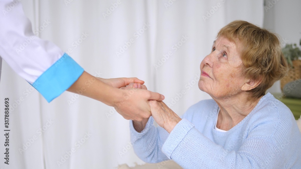 Fototapeta premium Helping Doctor Hands, Care For The Elderly Concept