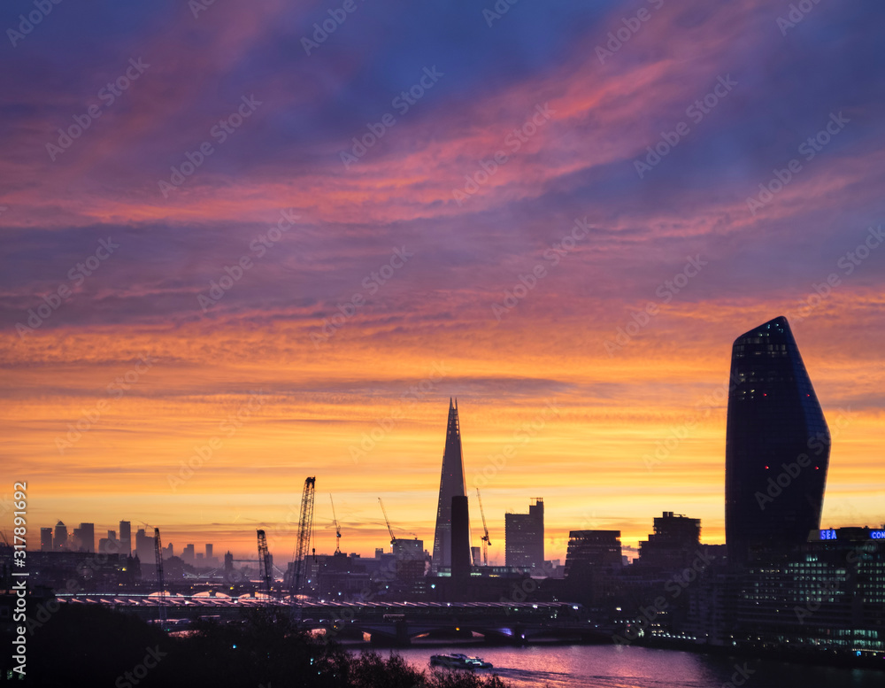 Epic dawn sunrise landscape cityscape over London city sykline looking East along River Thames