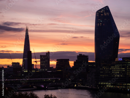 Epic dawn sunrise landscape cityscape over London city sykline looking East along River Thames photo