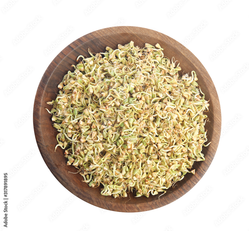 Wooden plate of sprouted green buckwheat isolated on white, top view Wooden plate of sprouted green buckwheat isolated on white, top view