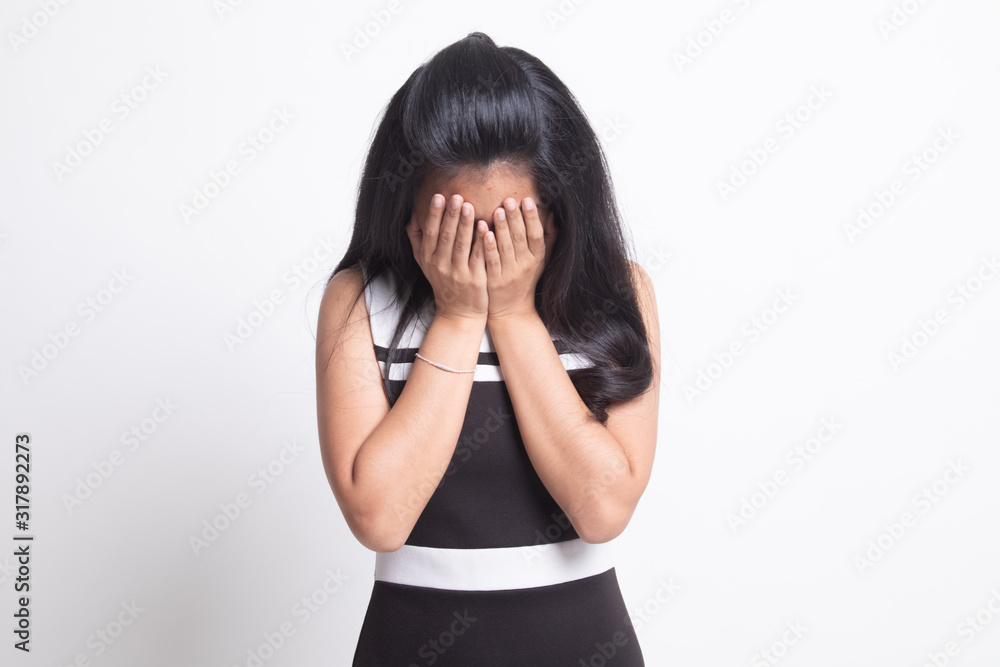 Sad young Asian woman cry with palm to face. Sad young Asian woman cry with palm to face.