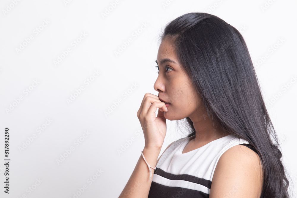 Unsure hesitant nervous young asian woman biting her fingernails. Unsure hesitant nervous young asian woman biting her fingernails.