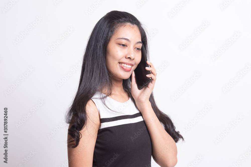 Young Asian woman talking with mobile phone. Young Asian woman talking with mobile phone.