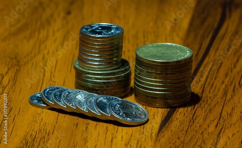 stack of coins on wooden table