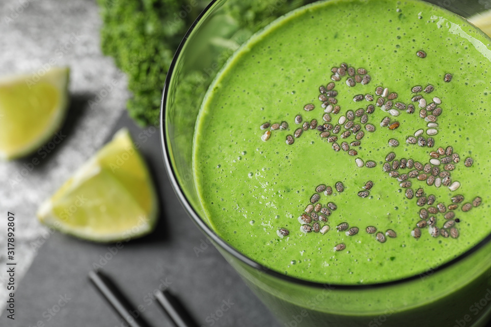 Tasty kale smoothie with chia seeds on table, closeup Tasty kale smoothie with chia seeds on table, closeup