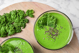 Tasty kale smoothie with chia seeds on table, flat lay