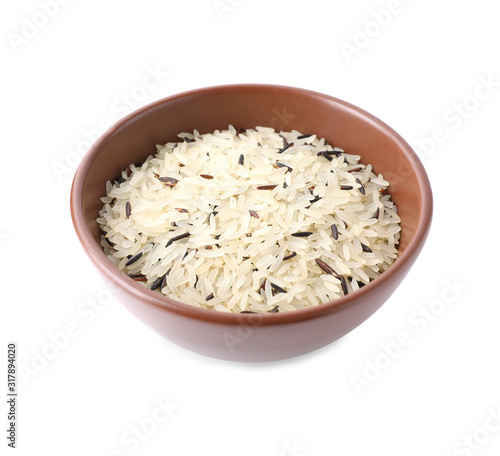 Mix of brown and polished rice in bowl isolated on white