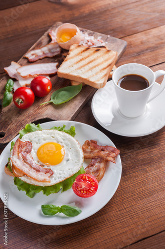 Coffee and fried eggs with bacon