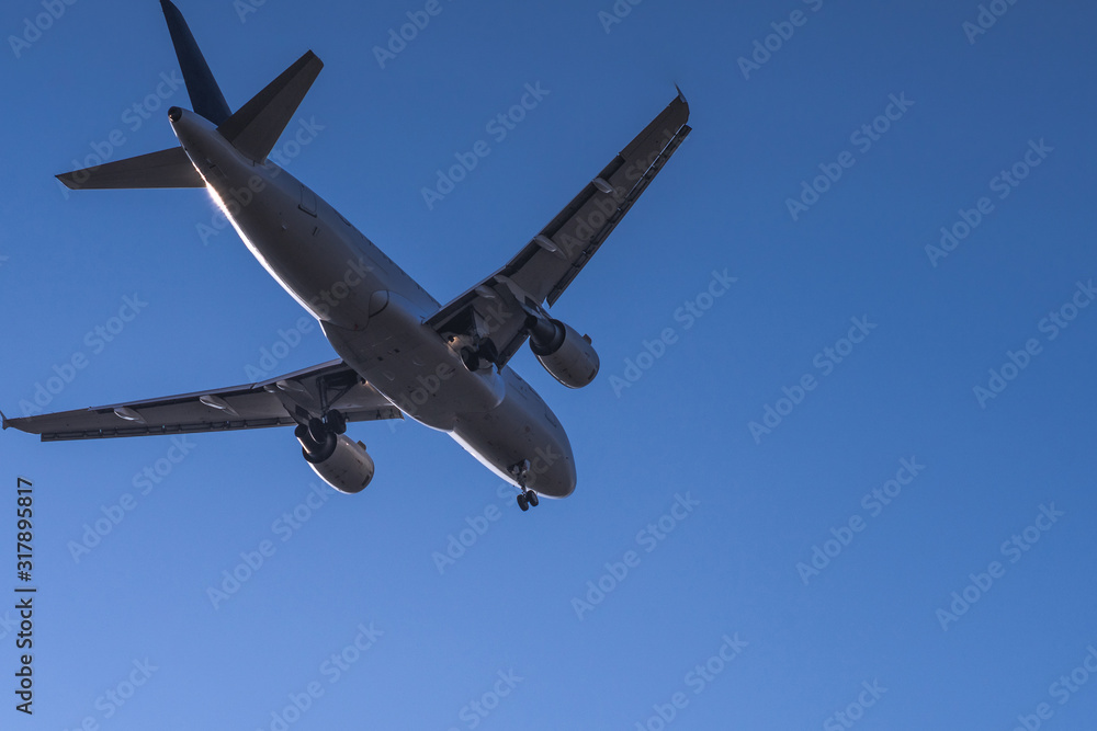 Close bottom view to landing passenger jet with clear sky at munich Close bottom view to landing passenger jet with clear sky at munich