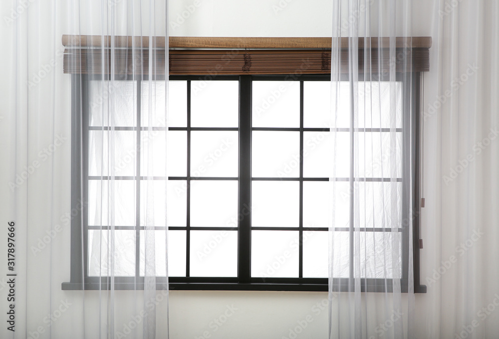 Window with beautiful curtains and open blinds in room Window with beautiful curtains and open blinds in room