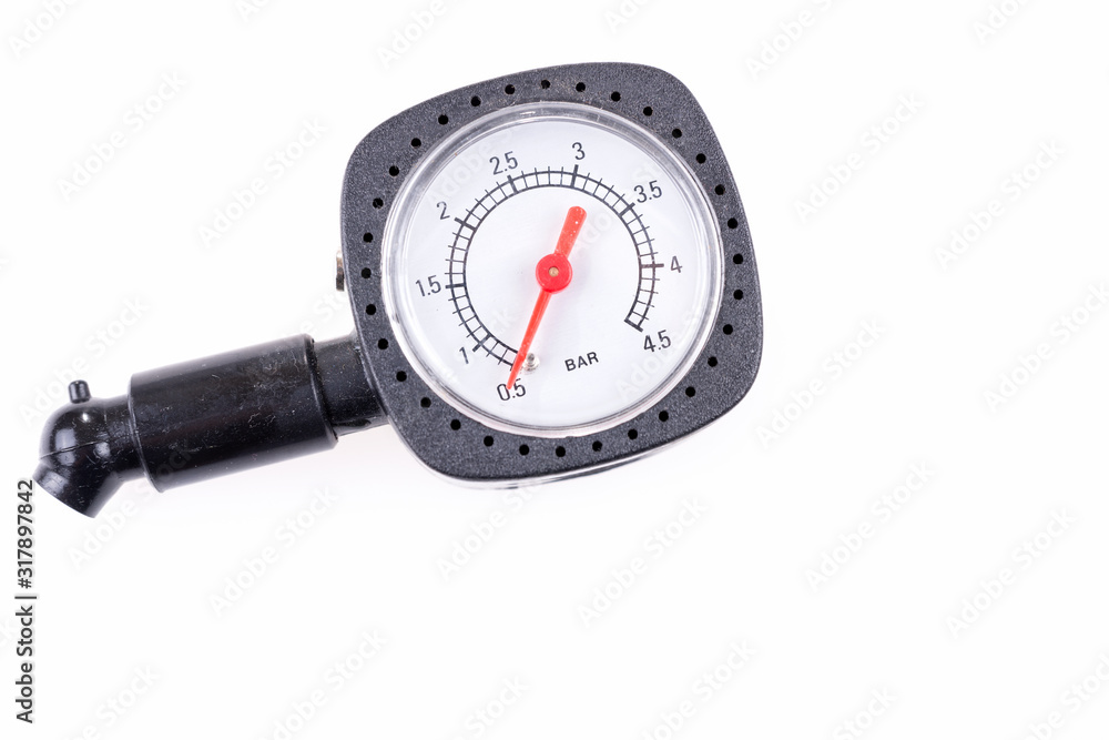 Pressure gauge for measuring air pressure in automobile tires isolated on white background Pressure gauge for measuring air pressure in automobile tires isolated on white background