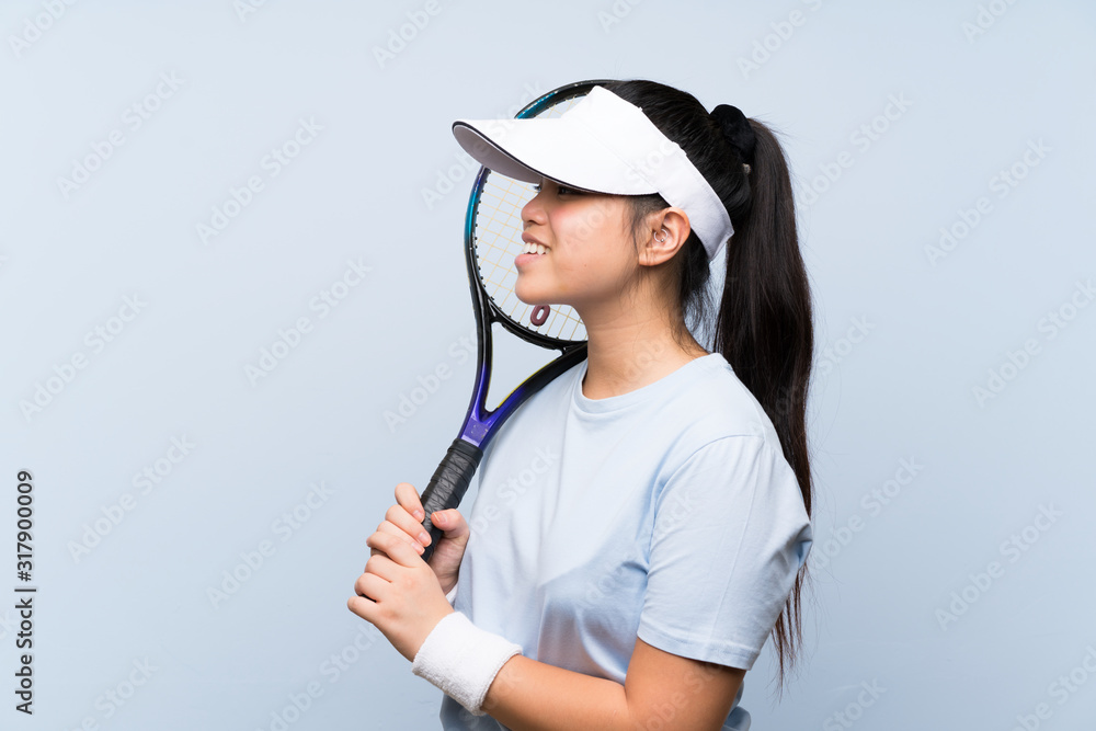 Young teenager Asian girl playing tennis Young teenager Asian girl playing tennis
