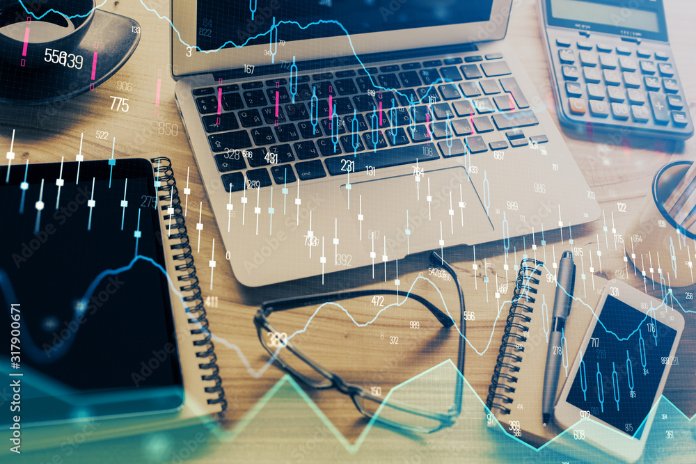 Double exposure of chart and financial info and work space with computer background. Concept of international online trading. Double exposure of chart and financial info and work space with computer background. Concept of international online trading.