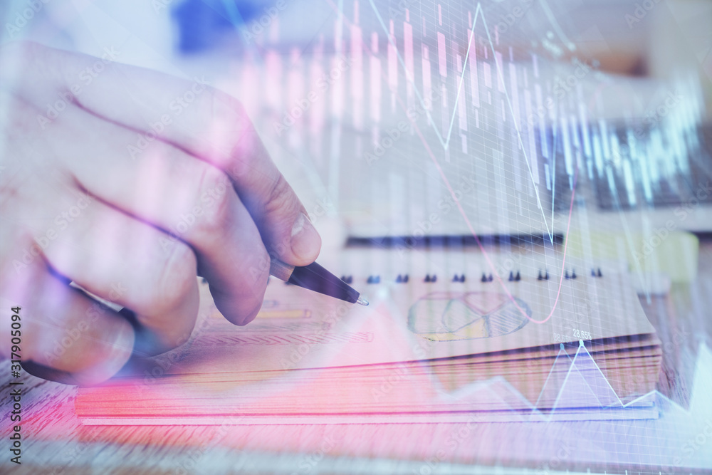 Multi exposure closeup hands with stock market forex graph. Multi exposure closeup hands with stock market forex graph.