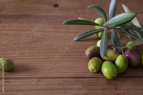 olives with branch on wood
