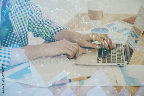 Multi exposure of stock market chart with man working on computer on background. Concept of financial analysis.