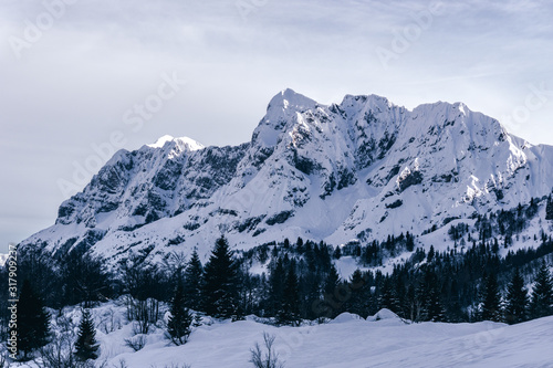 The Italian Alps, at sunset, after a snowfall, near the town of Ardesio, Italy - December 2019.